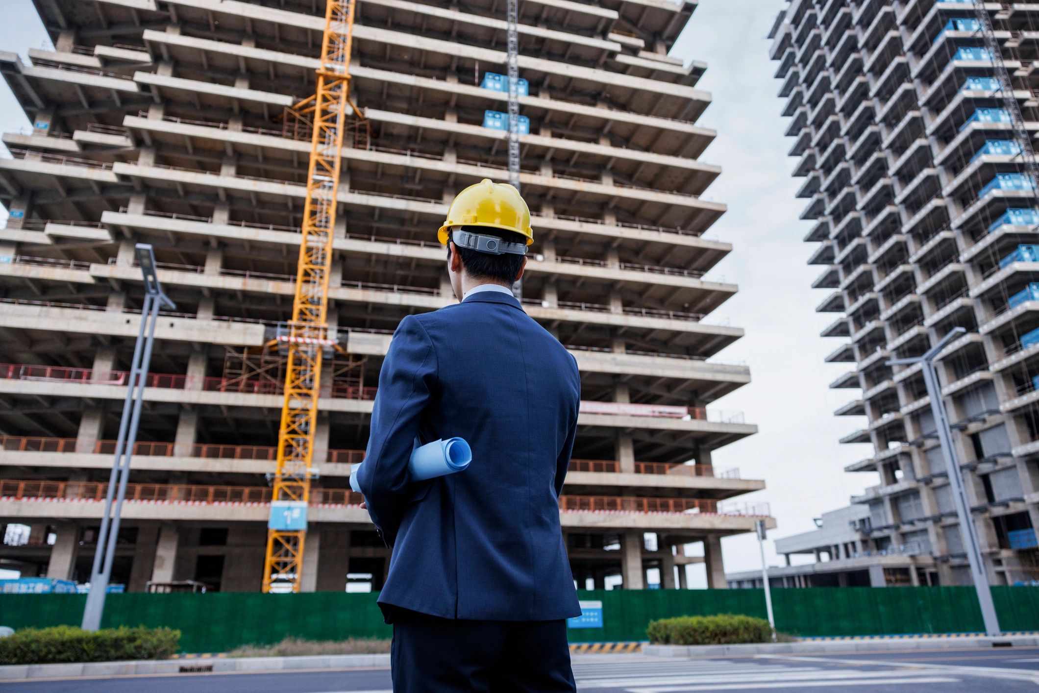 Site engineer reviewing drawings on a commercial construction site